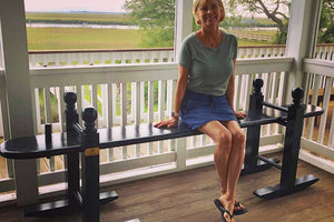 Lisa Stevens sitting on her joggling board overlooking the marsh on Edisto Island, SC.