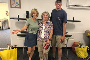 The President of Kings Daughters, Isabelle Mims standing with the winners of a raffled joggling board. All proceeds returned to Kings Daughters to help others in the community.