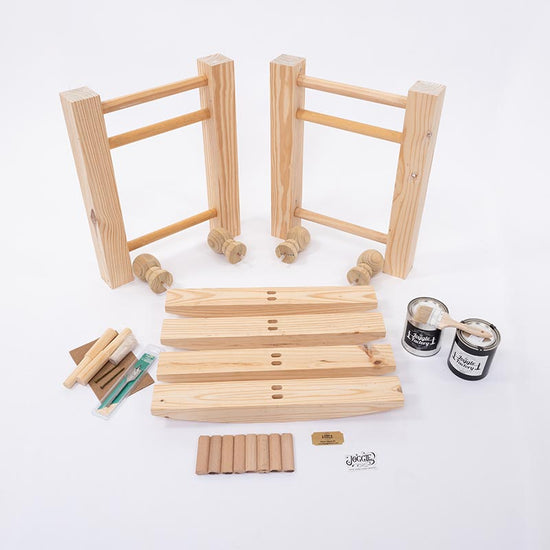 Showing all the contents of what comes in the box from The Joggle Factory for a unfinished joggling board.