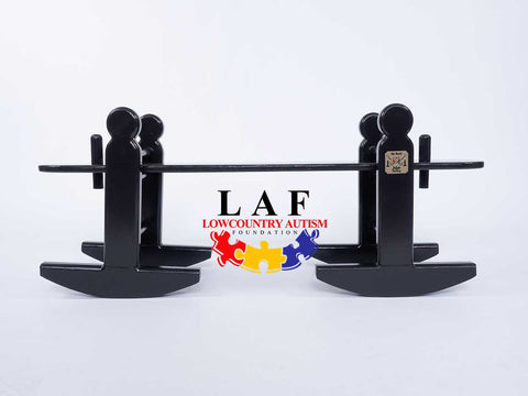 A Charleston Green children's size joggling board with white background.  Logo of Lowcountry Autism Foundation below joggling board because of a collaboration formed between The Joggle Factory and LAF.