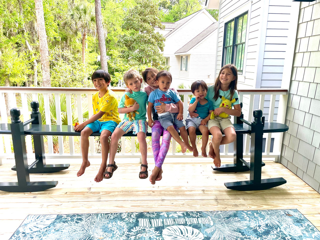 Six grandchildren enjoying their joggling board on their front porch in Kiawah, SC.