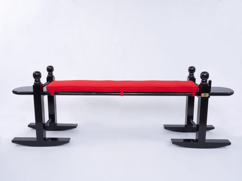 8' Charleston Green joggle bench with bright red cushion on white background.